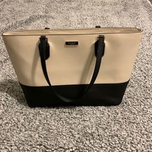 Gently used Kate Spade Bag.  Tan and black. No frays on handles.